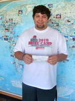 Image: Ivan Roldan — The world is Ivan’s now that he is going to college. He is pictured holding his scholarship check.