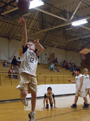 Image: Garret Janek — Italy 20’s Garret Janek(12) attempts his pre-game layup before the contest against Hillsboro Red.