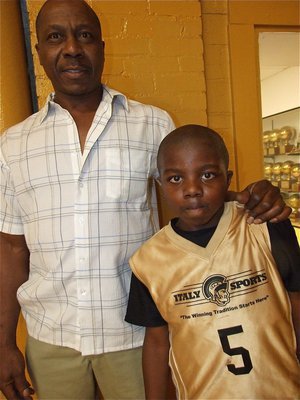 Image: Proud Grandad! — Ernest Smith stands with his grandson Taron Smith(5) after the win over Hillsboro Black. From Milford, Taron is just one of the many athletes from neighboring towns that participate in IYAA Sports.