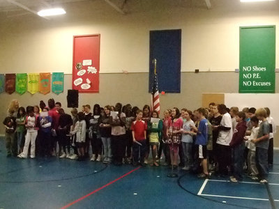 Image: Sixth Grade Class — Sixth graders were honoring the veterans through a poem.