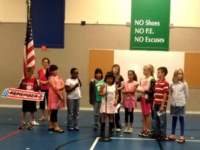 Image: Fourth Grade — Fourth graders recited a poem to the word remember.