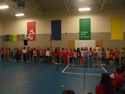 Image: Second Grade — Second graders were singing to the Veterans about how they would like to build a house and furnish it with love!