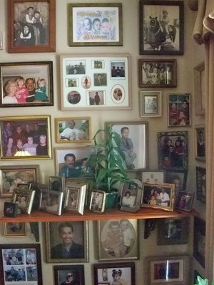 Image: Grandchildren’s Wall — There are fourteen grandchildren in all displayed proudly on this wall.