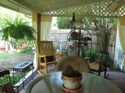 Image: Back Patio — Can’t you see yourself here sitting having a glass of ice tea?