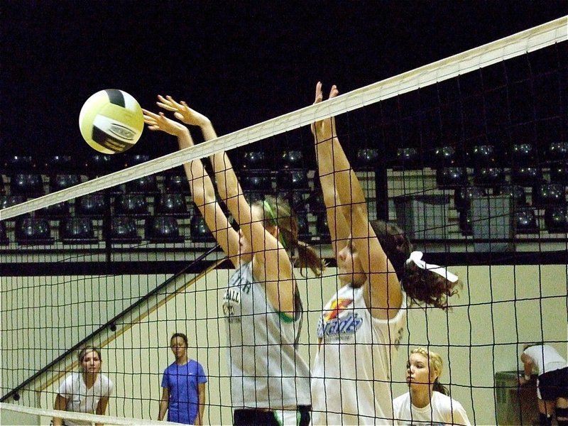 Image: Block party — Kaitlyn Rossa and Anna Viers make the block during practice.