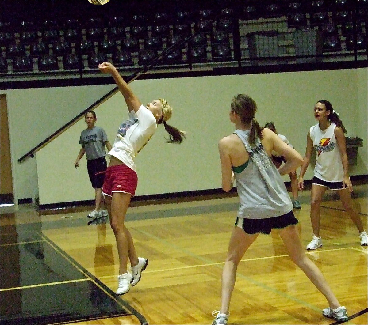 Image: Athletic play — Sierra Harris executes a bump pass to give her teammates an opportunity to make a play.