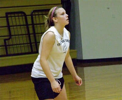 Image: Cassi concentrates — Cassi Jeffords is ready in the backcourt for the serve.