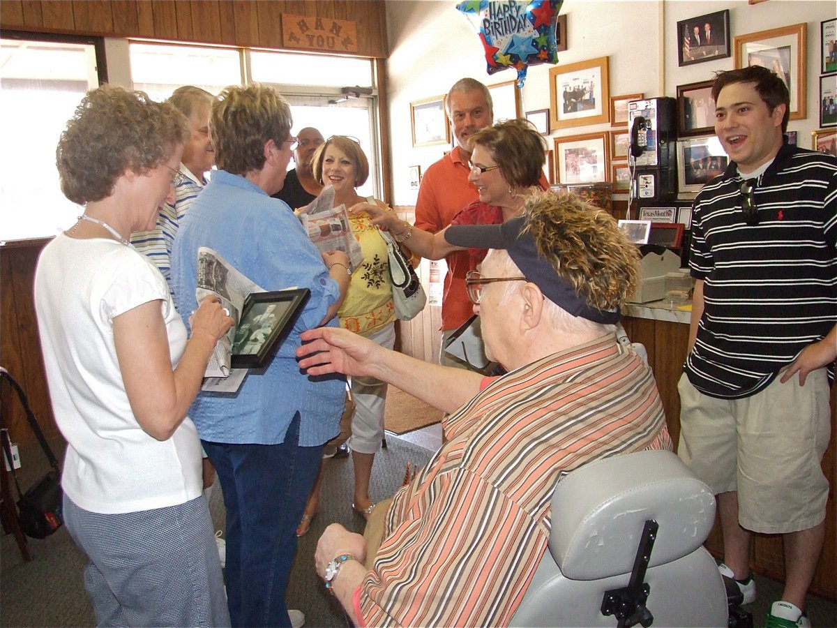 Image: Greeting guests — Relatives arrive with birthday gifts for Ervin.