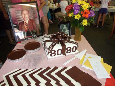 Image: Creative cake — Ervin’s 80th birthday cake was a decorated as a wrapped present by Charlesa Sims of Creative Cake Decorations in Waxahachie.