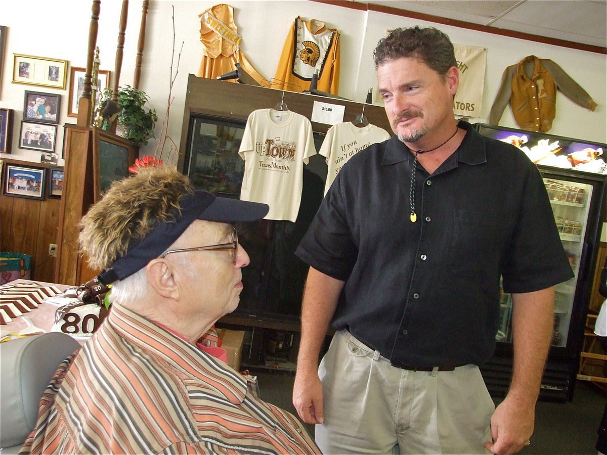 Image: “Doc” and John Beal — Ervin shows off his cap of hair to nephew John Beal Meroney. On a side note, I named my FFA pig after John Beal.