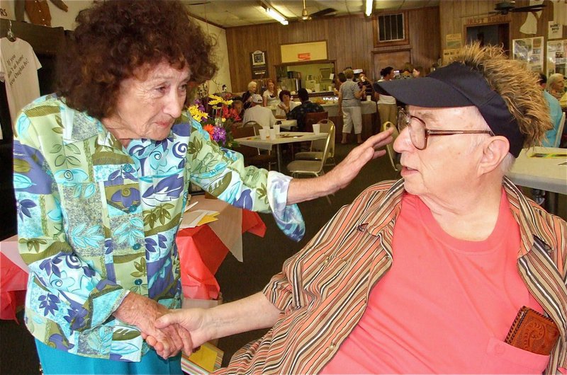 Image: Howdy, neighbor! — Long time neighbor of the Byers family Verna Clem stops by to see “Doc” during his 80th birthday party.