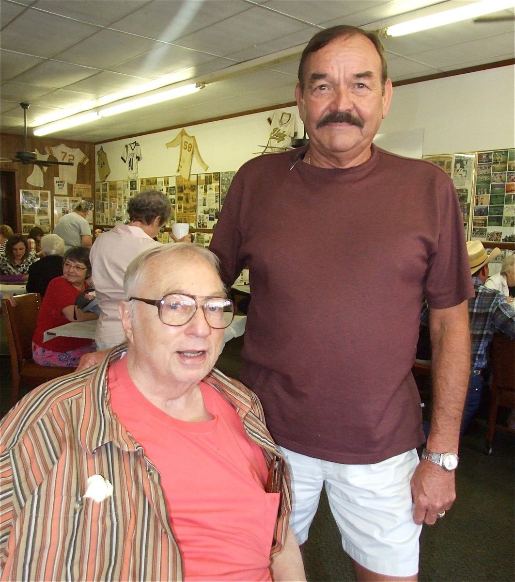 Image: Friends in business — Ronnie Hyles of Ronnie Hyles Home Supply in Italy visits with Ervin during the party. Ronnie mentioned, “Doc took care of my teeth and I took care of his buildings. In fact, I purchased the washateria from Doc and it’s been the headquarters for Ronnie Hyles Home Supply ever since.”