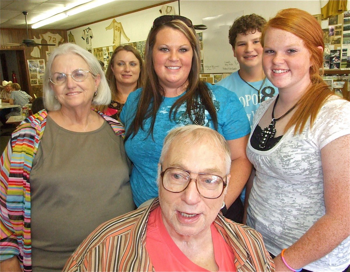 Image: Happy family — It was a great day for Ervin as he haults his wheelchair just long enough to get a picture taken with his wife Ann Byers, his daughter Jane Byers and grandchildren Lauren Byers, John Byers and Katie Byers.