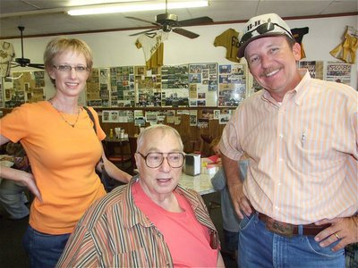Image: Big smiles — Charlesa &amp; Heath Sims take a picture with Ervin. Charlesa owns New Creations Cake Decorations and Heath, Ervin’s nephew, is the Ellis County Commissioner of Precinct 3. Ervin is a sit down comedian.