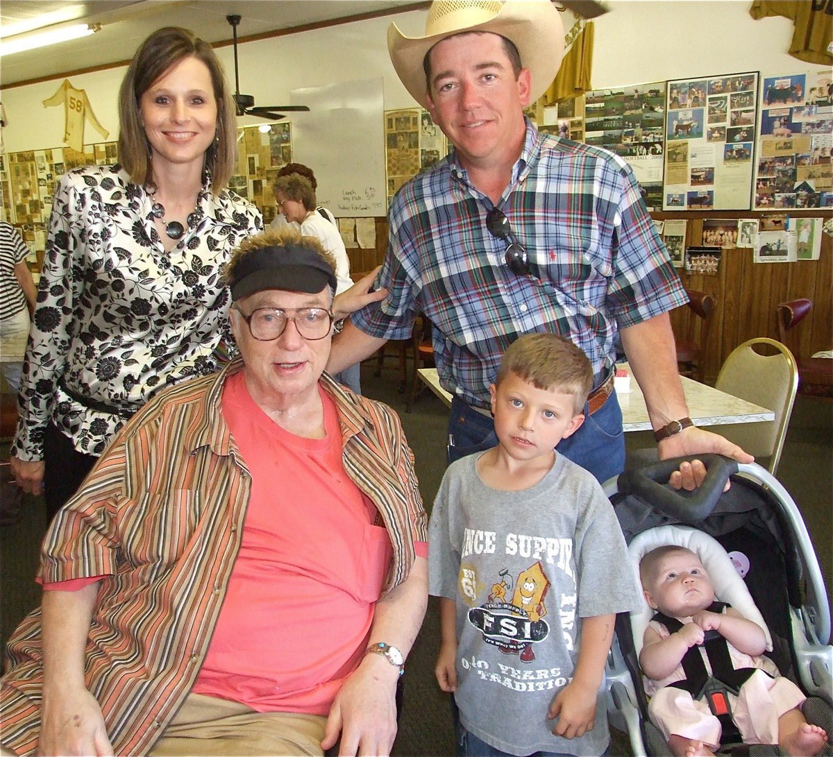 Image: Congratulations! — Angela &amp; Glenn Sims and their two little ones, Cade and baby Cassie, stopped by to celebrate with Ervin on his special day. Ervin’s nephew, Glenn owns a construction business and Angela is a hospital worker.