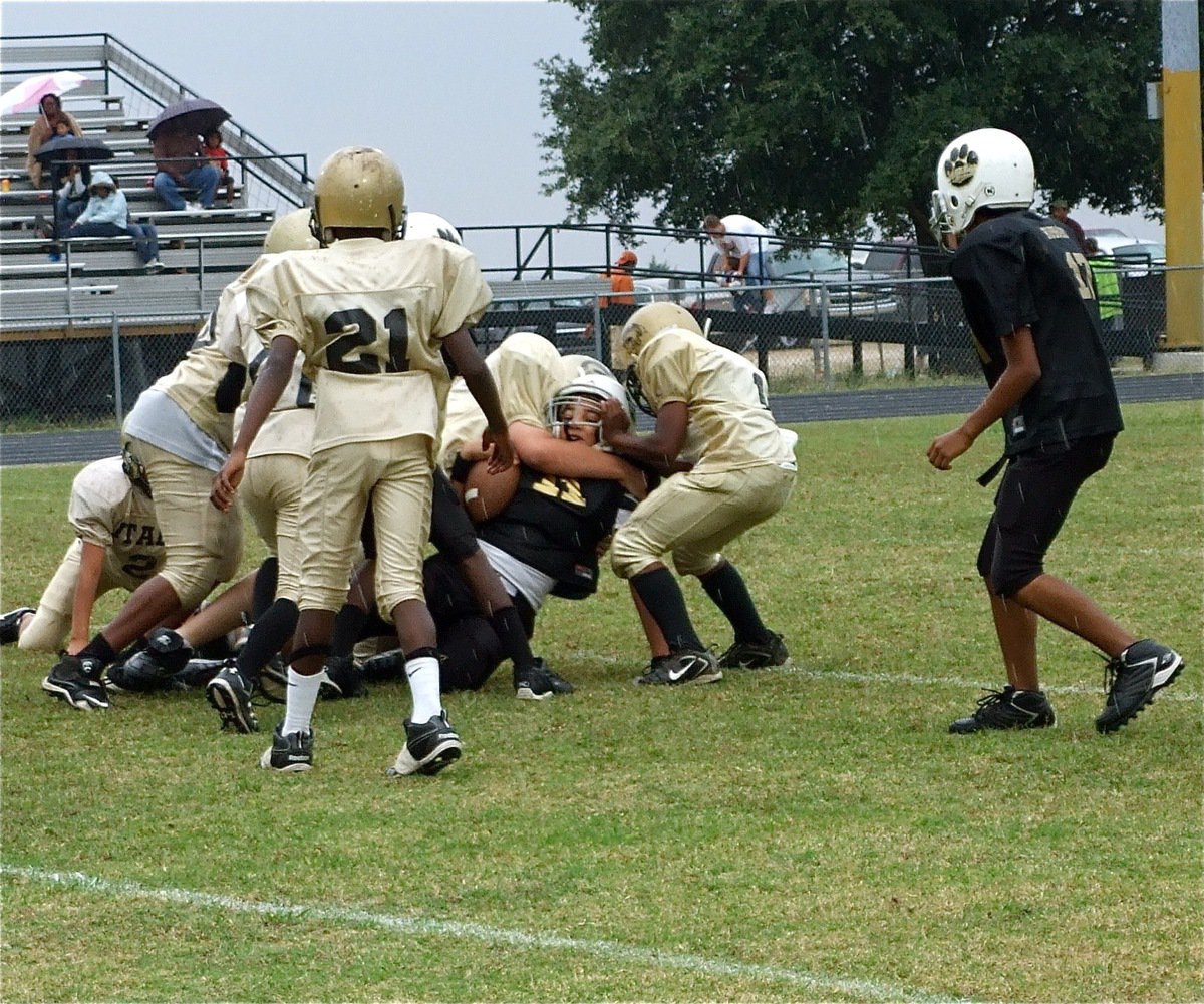 Image: Big stop — Aaron Pittmon(61) hammers a Hubbard runner for no gain as Kendrick Norwood(1) helps to make sure the Jaguar goes down.