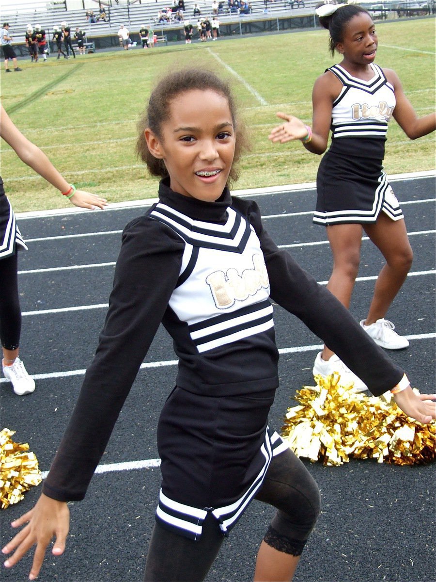 Image: Twist and shout! — IYAA Majors Cheerleaders Elisha McClendon and Quintera Washington do a little twist against Hubbard.