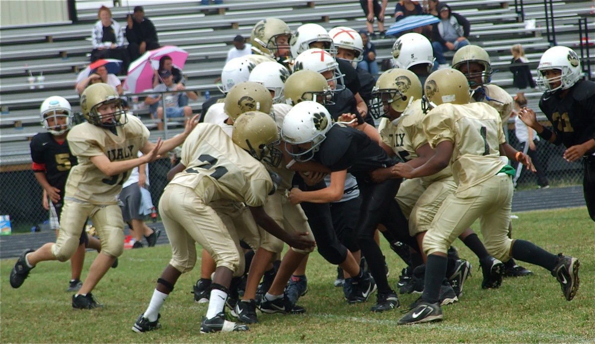 Image: Team defense — It took the whole defense working hard for four quarters to help the A-Team Gladiators get their second win, 13-7 against Hubbard.