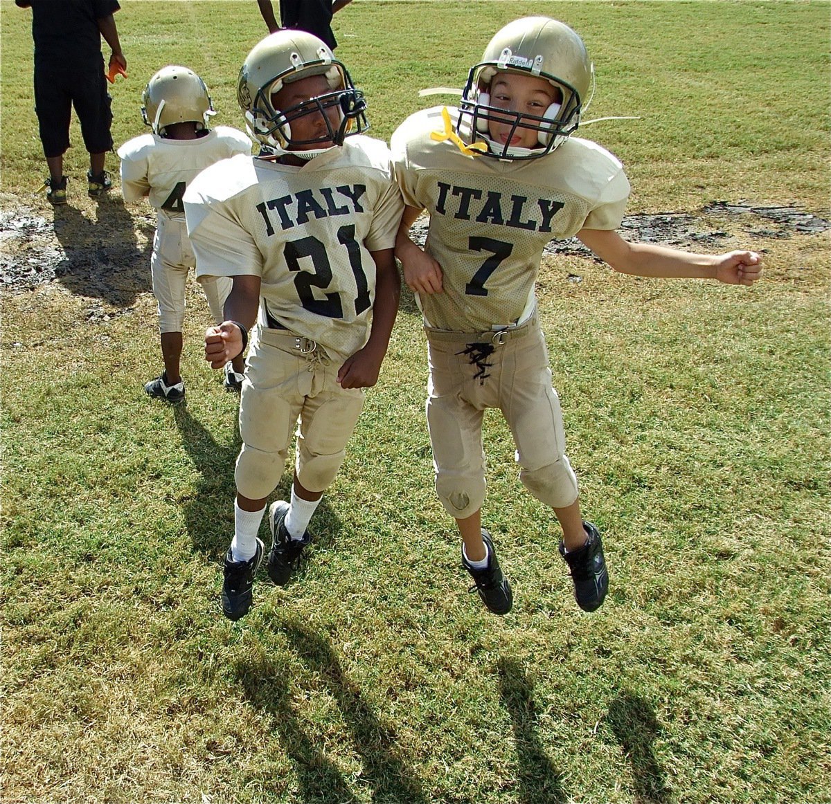 Image: Jump for Joy! — The IYAA B-Team Gladiators celebrate their undefeated streak of 5-0 after defeating Rice 30-6.