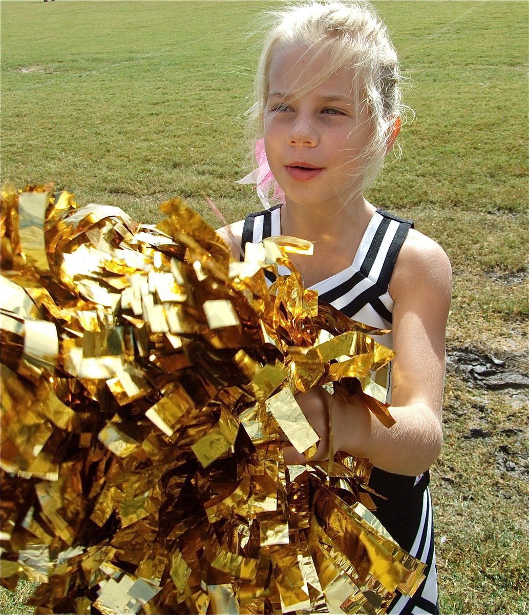 Image: Lacy cheers — IYAA Cheerleader Lacy Mott cheers from the sideline.