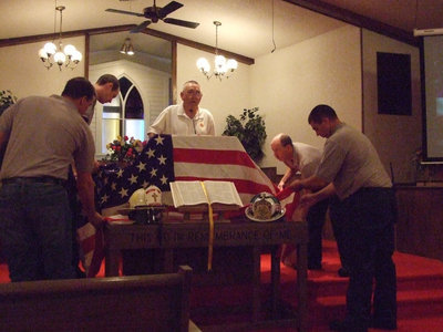 Image: The flag ceremony — There are meanings for each fold in the American flag.