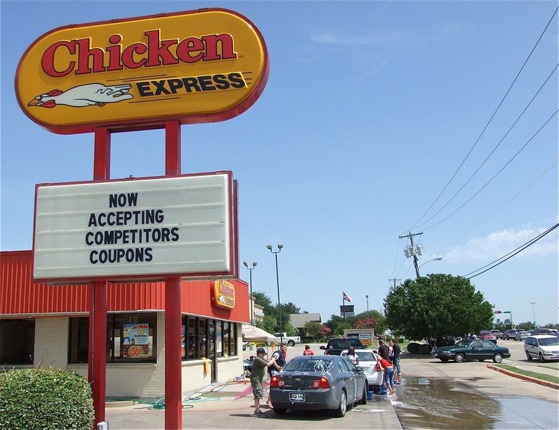 Image: Fast food, clean cars and the IHS band washes on… — The Italy Gladiator Regiment Band conducted a fund-raising car wash at the Chicken Express Restaurant in Waxahachie on Saturday. The IHS Band hopes to raise funds for a spring break trip to Florida and compete in a week-long tournament.