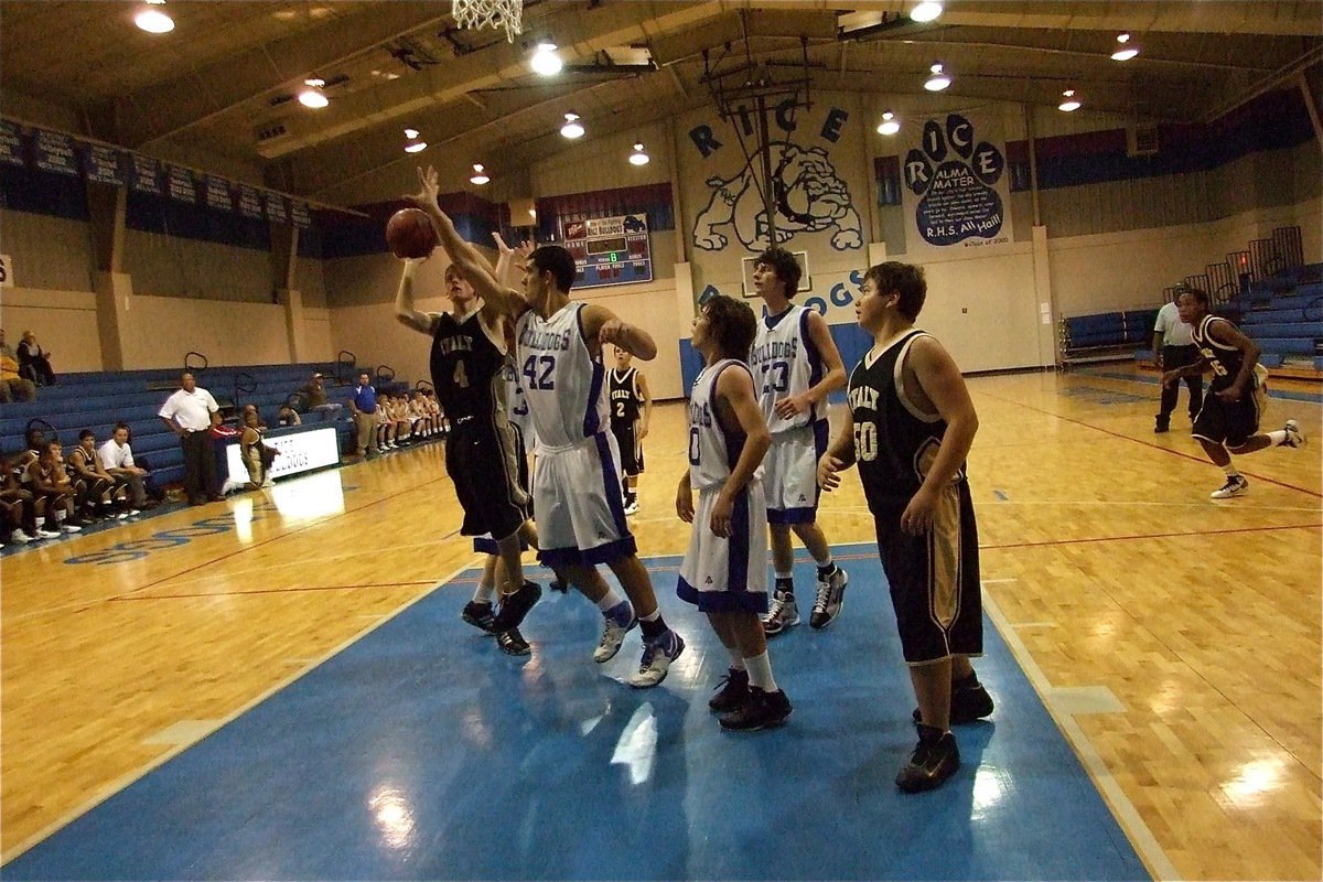 Image: Wood in the paint — Justin Wood(4) puts up a shot in the lane as the J.V. Gladiators pile up the points.