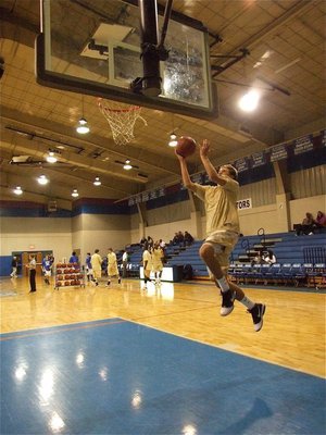 Image: Cole practices — Gladiator Cole Hopkins works on his layups before the game against Rice.