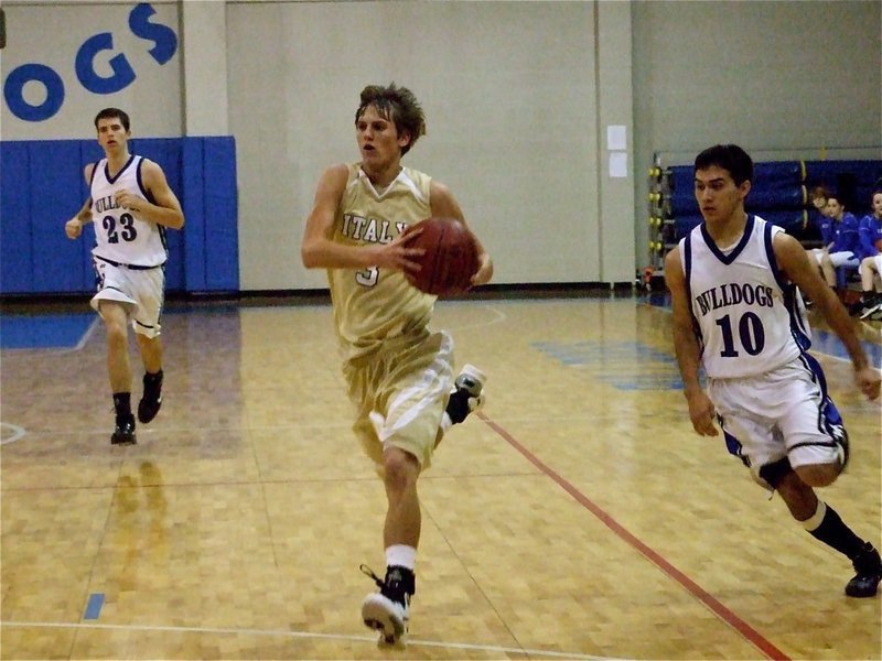 Image: Hurry, Jase! — Jase Holden(3) sprints the floor and gets the pass away before the Bulldogs can reach the ball.