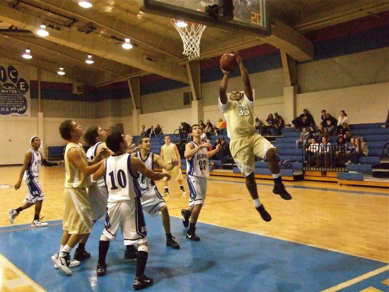 Image: Muscular move — De’Andre “Muscle Bob” Rettig(33) powers toward the goal.