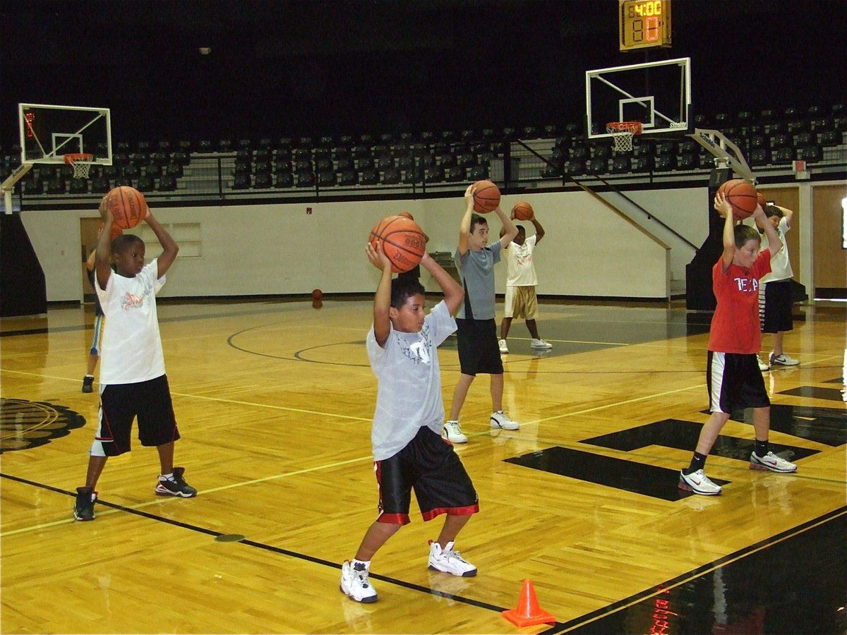 Image: Drill time — Jarvis Harris, Tylan Wallace, Scott Connor, Kenneth Norwood and Ty Evans prepare to start a ball handling drill.