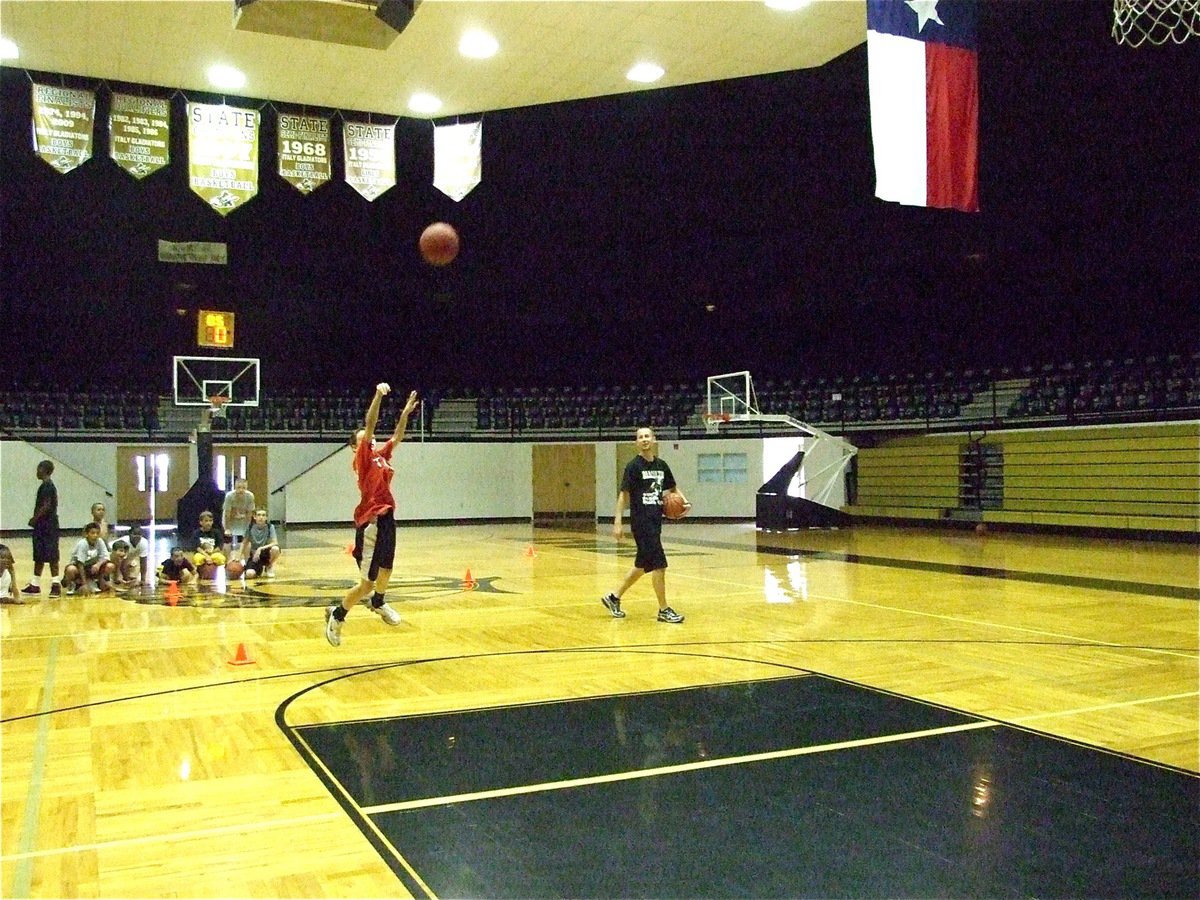 Image: Ty beats buzzer — Ty Windham beats the buzzer to win a shooting challenge which included dribbling around cones from midcourt with a time limit.