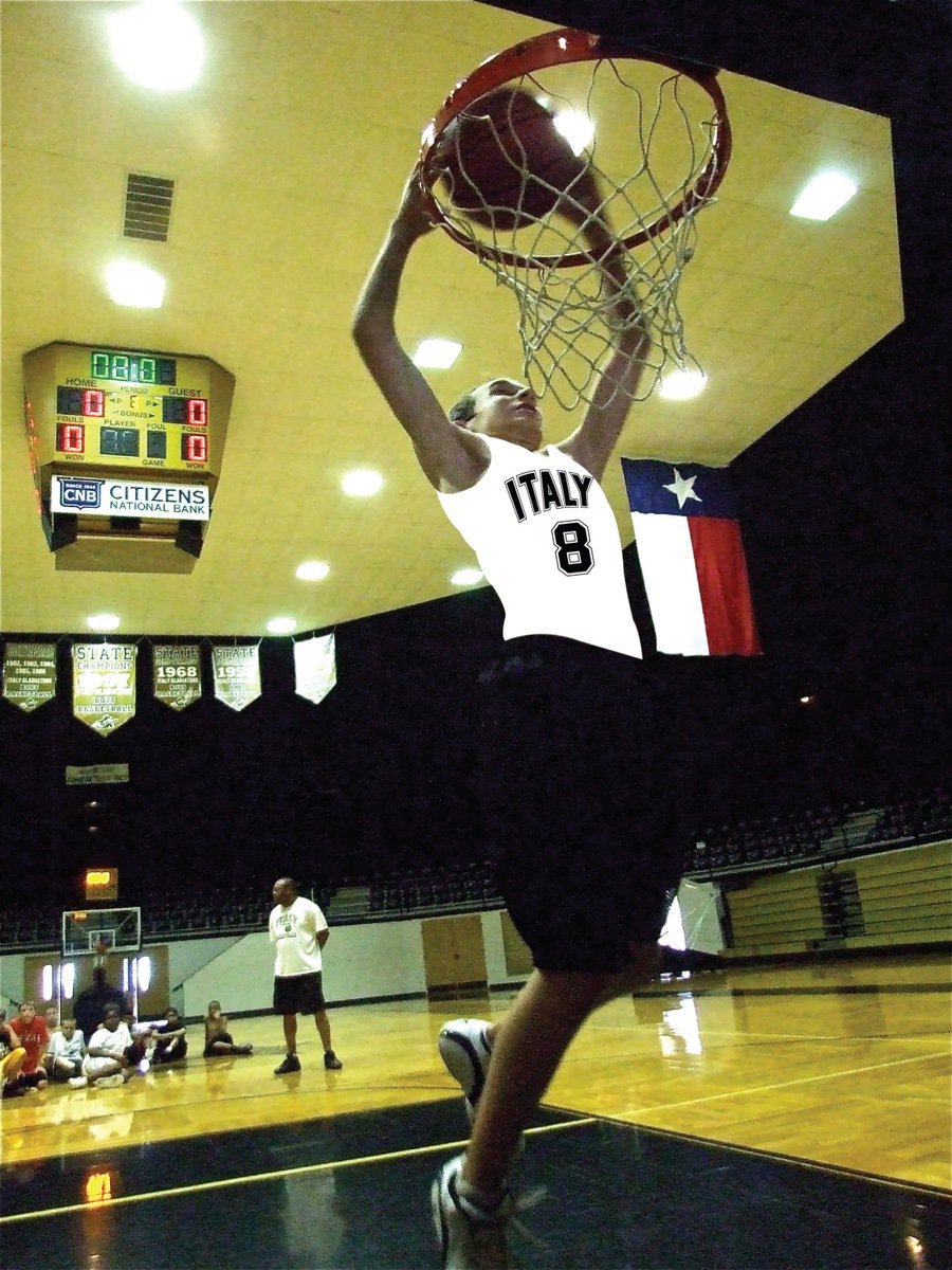 Image: Scott soars and slams — Scott Connor gets air and rattles the rim.