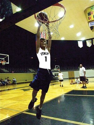 Image: Ty Hamilton dunks — Ty Hamilton flies in for a two-handed slam.