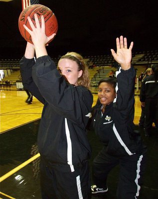 Image: Pre-game practice — Shelbi Gilley and Ashley Harper work on their low post moves before the game against Kemp.