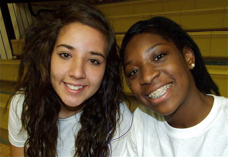 Image: Together we can — Varsity Lady Gladiators Alyssa Richards and Jameka Copeland get ready to open their season against the Kemp Lady Yellow Jackets.