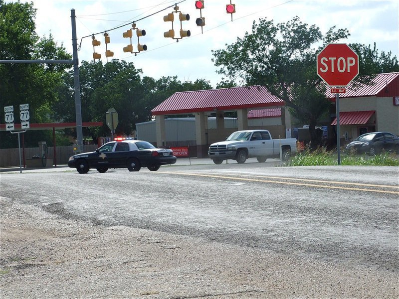 Image: Helps on the way — Multiple DPS troopers fly thru the Hwy 77 intersection in Italy on their way to Milford to assist Milford Police.