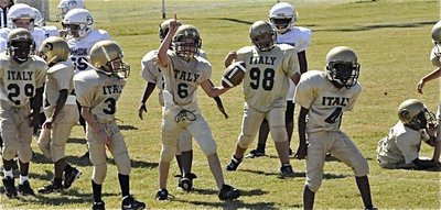 Image: We are #1 — Ryder Itson(6) and Jalon Davis(4) celebrate a fumble recovery with their Minor teammates.