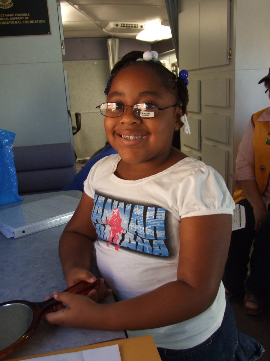 Image: Alandia Montgomery — Alandia Montgomery is trying on a pair of frames to see which one she likes best.