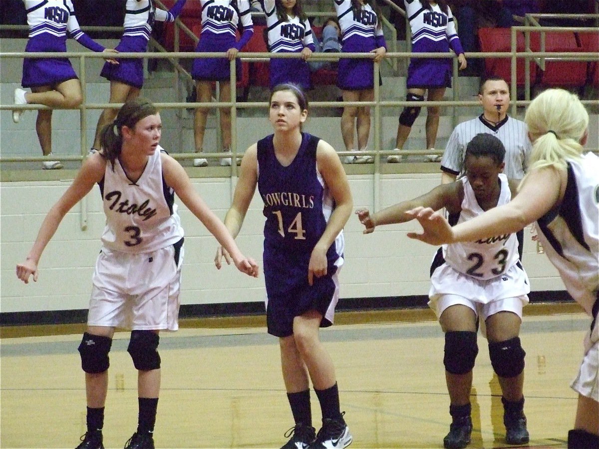 Image: Defending the boards — Lady Gladiators Kaitlyn Rossa(3), Brianna Burkhalter(23) and Megan Richards(22) prepare to rebound a Mason free throw attempt.