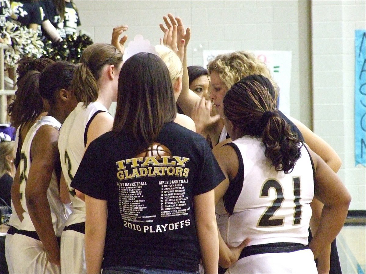 Image: Stick with the plan — Head coach Stacy McDonald tries to guide the Lady Gladiators through a tough 1st half of basketball in the area championship.