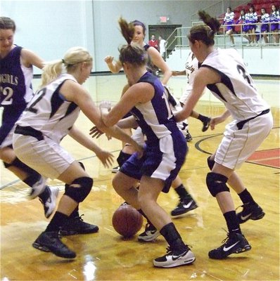 Image: Battle for the ball — Megan Richards(22), Alyssa Richards(24) and Kaitlyn Rossa(3) scramble for a lose ball.
