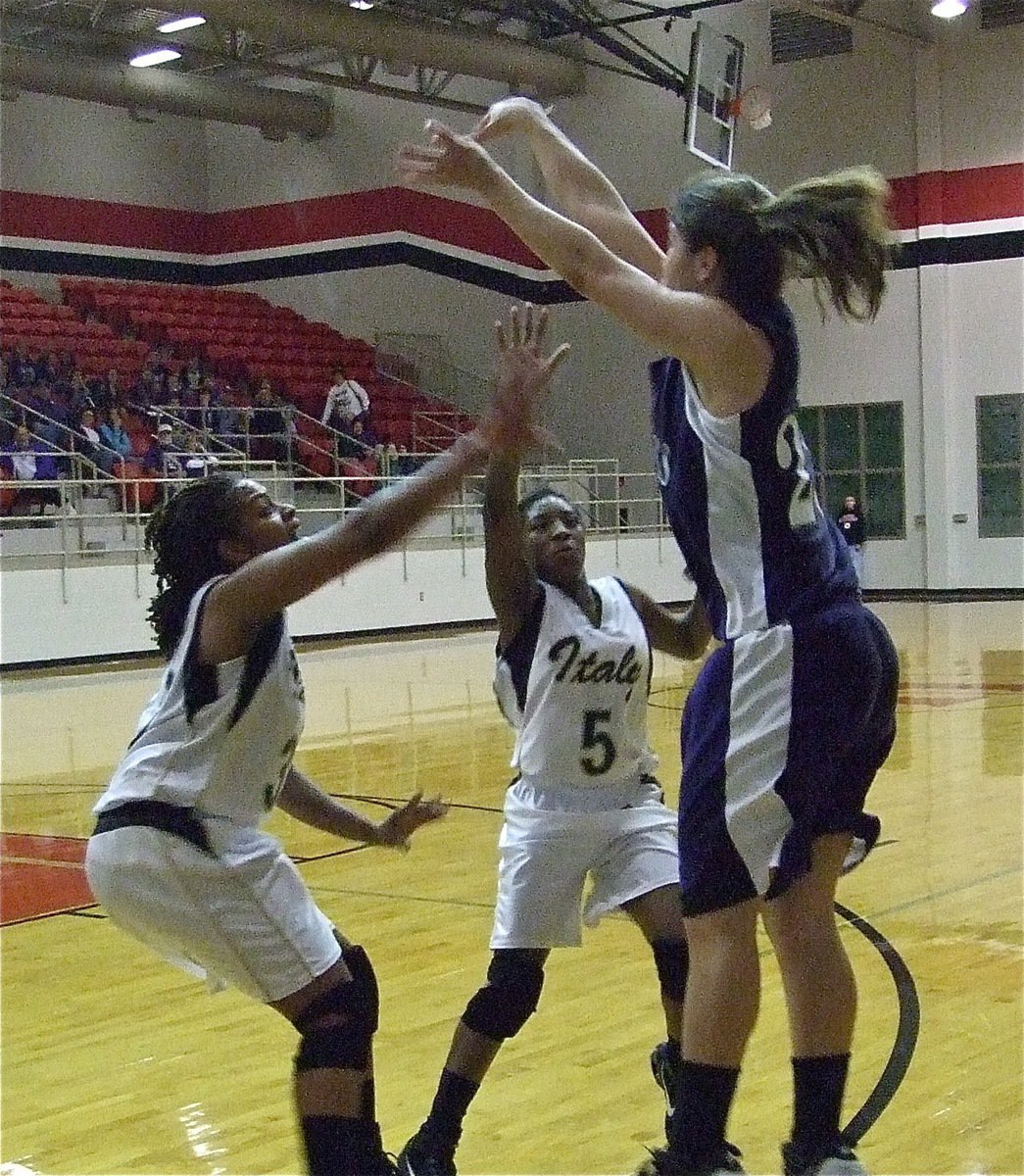 Image: Contesting the shot — Jaleecia Fleming(32) and Jameka Copeland(5) close out on a Mason shooter.