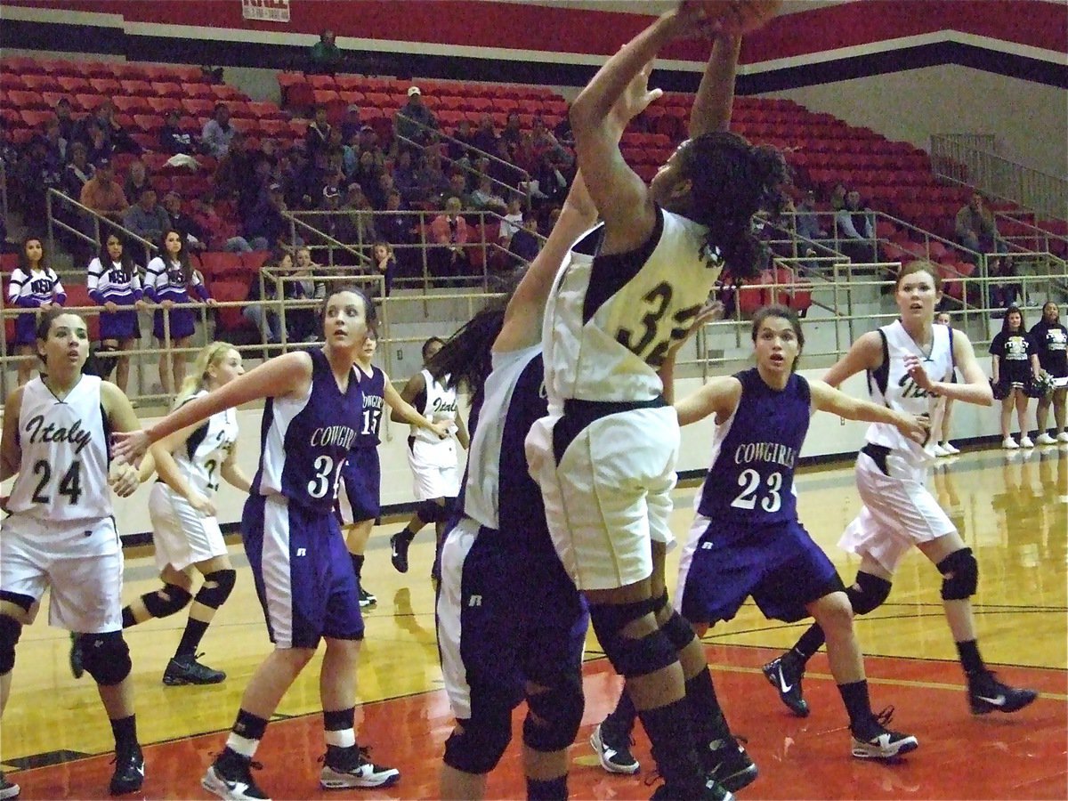 Image: Fleming for two — Lady Gladiator Jaleecia Fleming(32) rises to shoot the jumper with a Mason Cowgirl in her face.