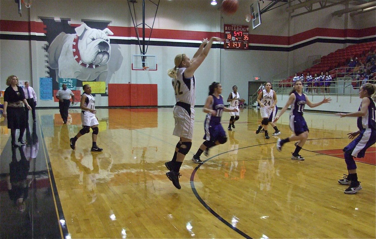 Image: The green light — Megan Richards(22) releases a 3-point shot in hopes of pulling off a 4th quarter comeback.