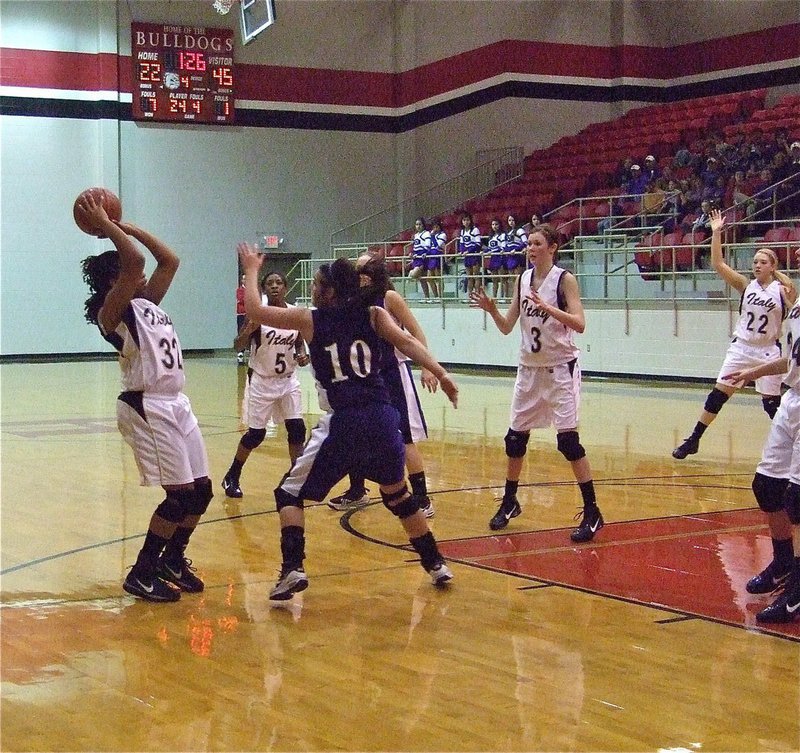 Image: Still battling — Lady Gladiator senior Jaleecia Fleming(32) ball fakes and then swishes the jumper against Mason.