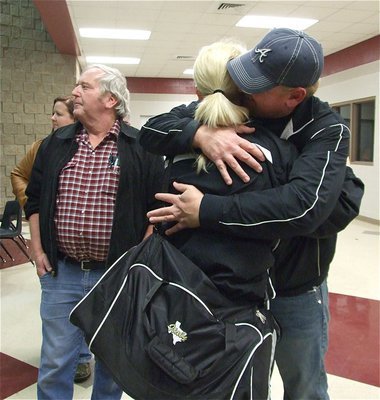 Image: Get ’em next year — Allen Richards gives his daughter Megan Richards a comforting hug after the game.