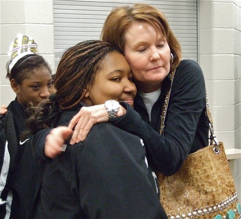 Image: We are proud of you! — Penny Rossa gives Lady Gladiator Khadijah Davis(21) a hug after Italy’s tough loss in the area championship.