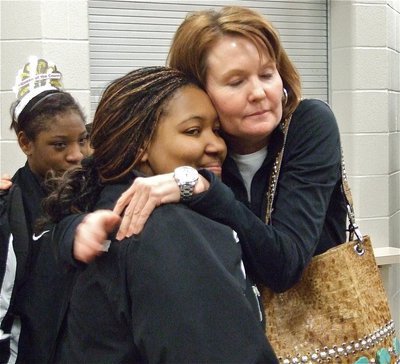 Image: We are proud of you! — Penny Rossa gives Lady Gladiator Khadijah Davis(21) a hug after Italy’s tough loss in the area championship.