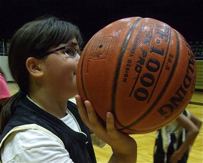 Image: For the win — Jenna Holden takes aim during a shooting drill where the campers tried to out hoop the coaches.